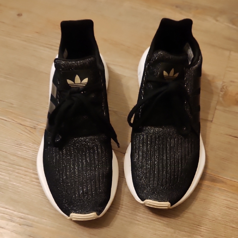 Adidas Edge Lux Black & Gold Flexi Runners with White Soles.